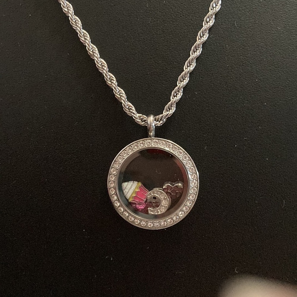 Origami Owl Circle Pendant with necklace and charms.